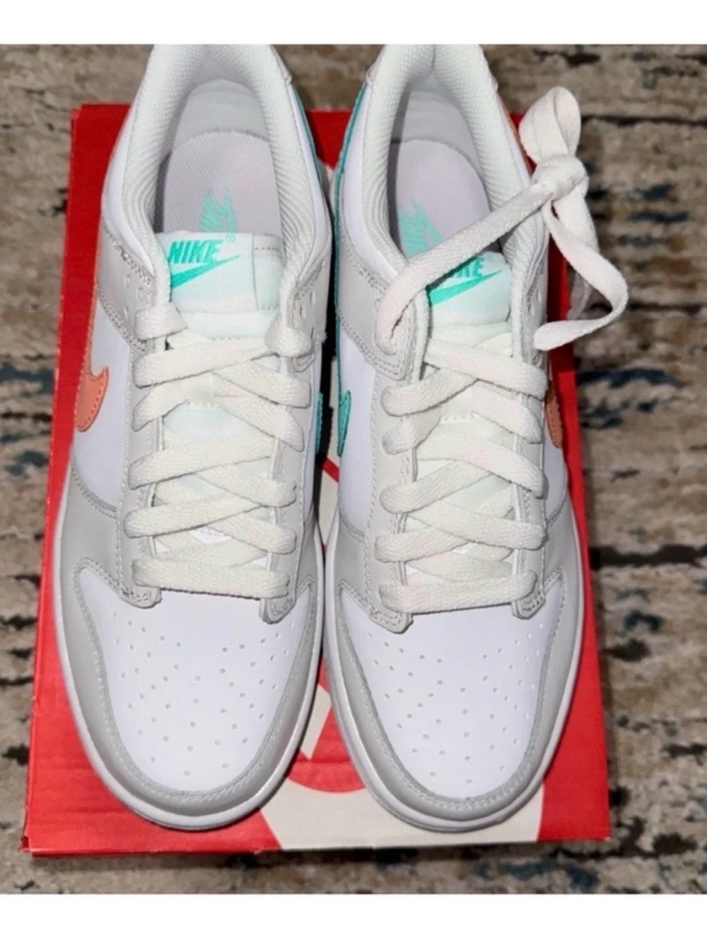 Nike White Low-Top Sneakers with Peach Swoosh